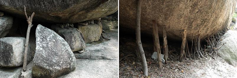 Точное, первоначальное значение традиции, подкладывать палочки под камни монахами не известно