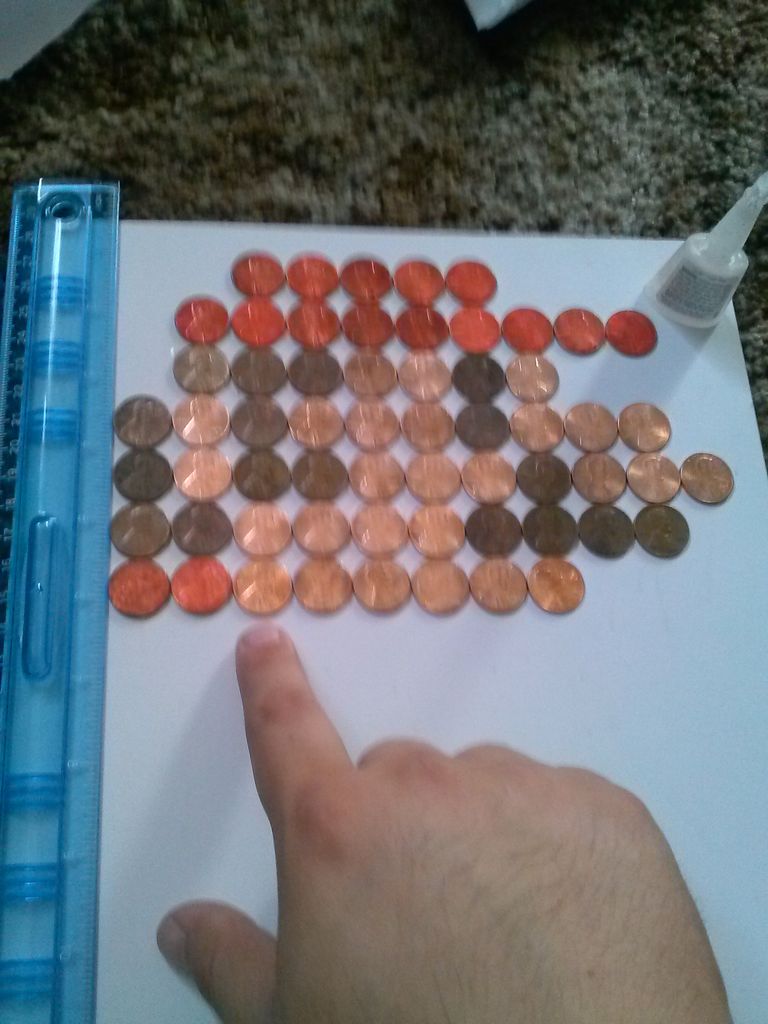 Пиксельная картина из 143 монеток